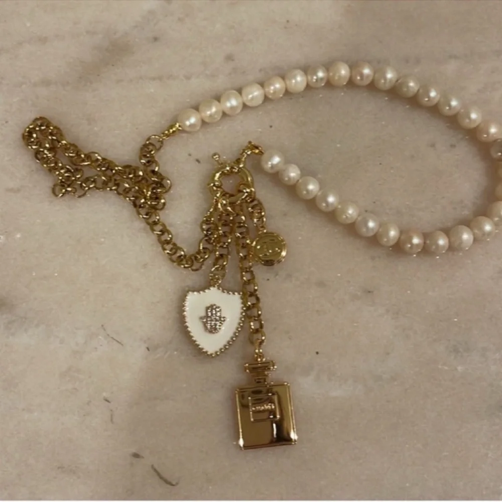 Chanel Holiday Fragrance Charm With Gold and Pearl Necklace